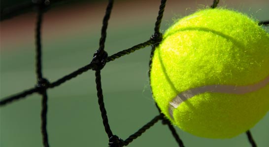 Tennis ball hitting the net